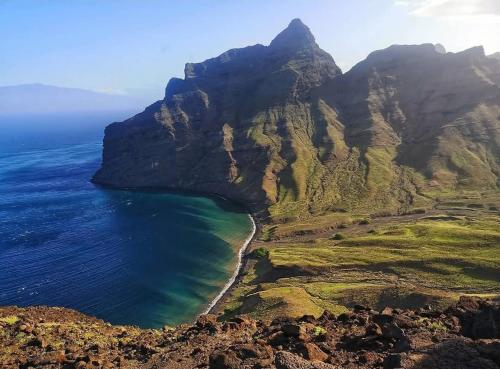 an aerial view of a mountain next to the ocean at Rosesplace Mindelo in Mindelo