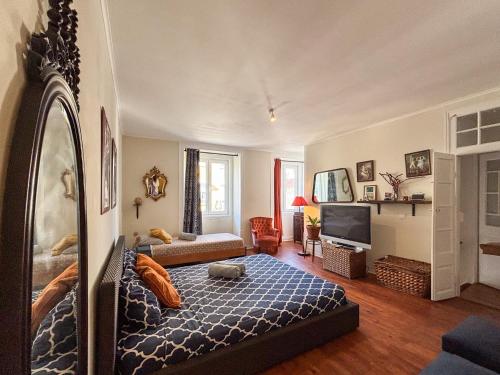 Postel nebo postele na pokoji v ubytování Boho Chic Apt