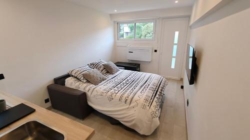 Llit o llits en una habitació de Studio moderne