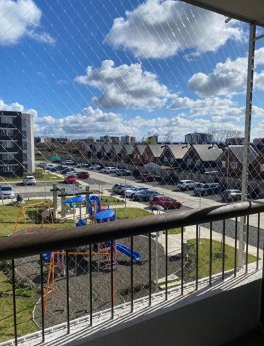 a view of a parking lot from a balcony at Departamento Osorno 3D 2B 2 estacionamiento in Osorno