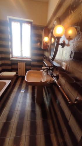 a bathroom with a sink and a mirror on the wall at Terry's House in Fondi