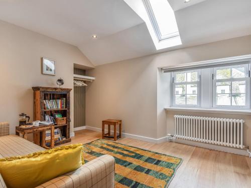 a living room with a couch and a window at The Granary - Uk34899 in Dunira