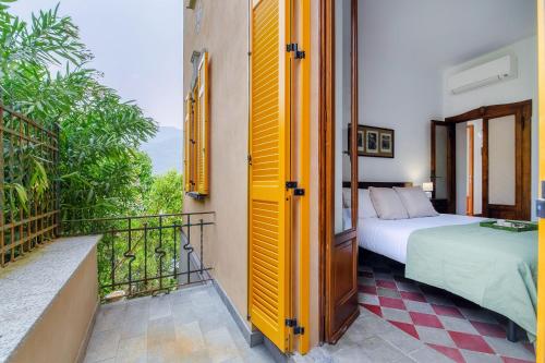 Katil atau katil-katil dalam bilik di Villa Eugenia Suite - by MyHomeInComo