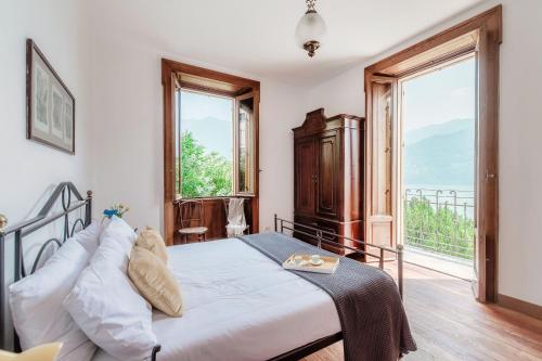 Postel nebo postele na pokoji v ubytování Villa Eugenia Suite - by MyHomeInComo