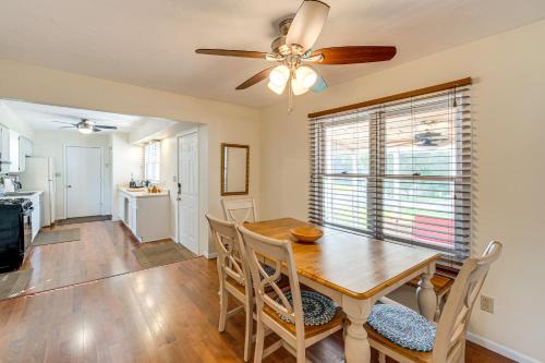 a dining room with a table and chairs and a ceiling fan at Powers Lake Gem Peek-a-Boo Views and Beach Access in Genoa City
