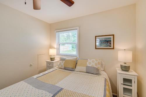 a bedroom with a bed and a window at Powers Lake Gem Peek-a-Boo Views and Beach Access in Genoa City