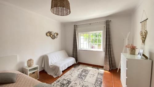 En eller flere senge i et værelse på Casa do Jardim