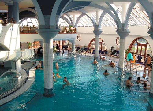 a group of people in a swimming pool at Aquatherma Termálfalu Zalaegerszeg in Zalaegerszeg