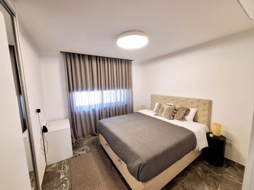 a bedroom with a large bed in a room at Panorama Luxury Summer Villa in Protaras