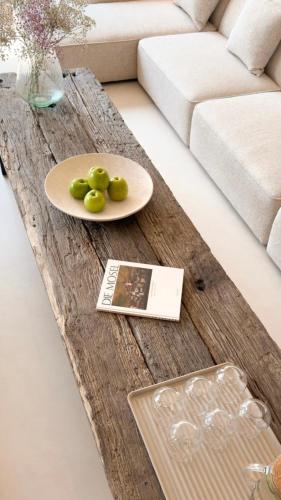 a coffee table with a plate of green grapes on it at Hotel Weinhaus Kreuter in Koblenz