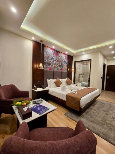 a hotel room with a bed and a living room at Romeo Lane Mussoorie - The Courtyard House in Mussoorie