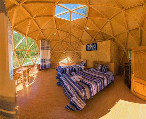 Ένα ή περισσότερα κρεβάτια σε δωμάτιο στο Salkantay Domes Eco Lodge