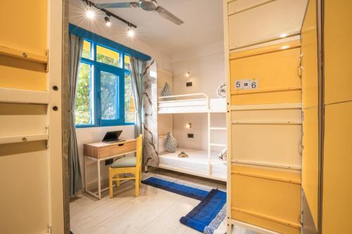 Ένα ή περισσότερα κρεβάτια σε δωμάτιο στο Shalom Backpackers Shimla