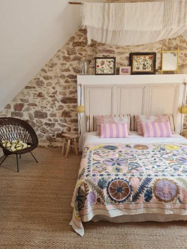 Ένα ή περισσότερα κρεβάτια σε δωμάτιο στο Gîte de charme entre terre & mer