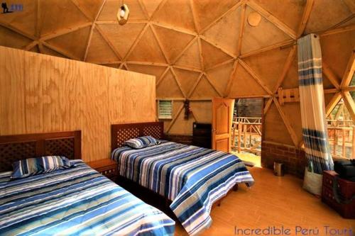 Ένα ή περισσότερα κρεβάτια σε δωμάτιο στο Salkantay Domes Eco Lodge