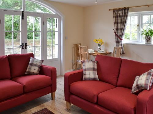 Posezení v ubytování Holly Cottage