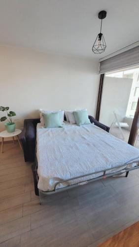 Letto o letti in una camera di Bello depto edificio Claro Solar 3 a 5 personas