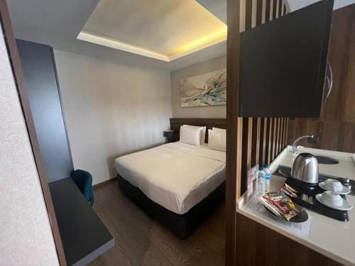 Ένα ή περισσότερα κρεβάτια σε δωμάτιο στο Ferah Suites Hotel