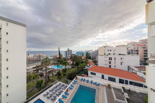 a view from the balcony of a building with a swimming pool at Casa Branca Apartment by Mth in Funchal