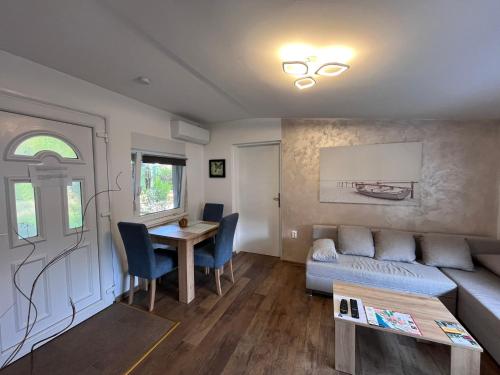 a living room with a couch and a table at Vasilija in Sremski Karlovci