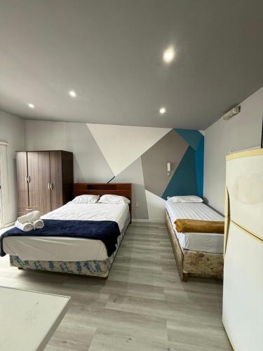 Llit o llits en una habitació de Apartamentos Centro