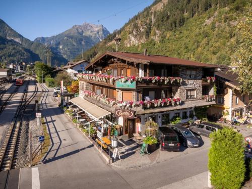 an overhead view of a building in a town with mountains at Hotel Landhaus Carla in Mayrhofen