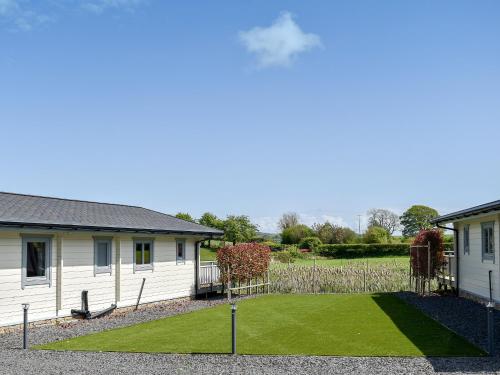 a house with a lawn in front of it at Oak Lodge - Uk30005 in Lindal in Furness