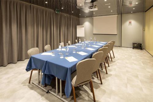 a conference room with a long table and chairs at Best Western Air Hotel Linate in Segrate