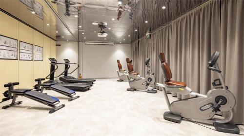 a gym with several treadms and cardio machines at Best Western Air Hotel Linate in Segrate