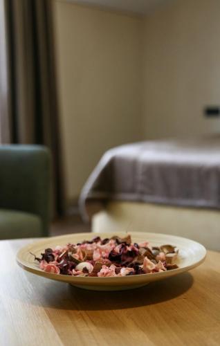 a plate of food sitting on a table at Hotel resort Sedula in Skogalis