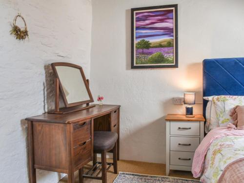 En eller flere senge i et værelse på The Stables