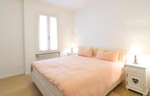 Łóżko lub łóżka w pokoju w obiekcie Al Campanile