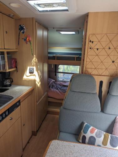 a kitchen and dining area of an rv at Quinta Lima in Sertã