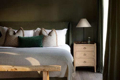 a bedroom with a bed and a table with a lamp at Saltmoore in Whitby