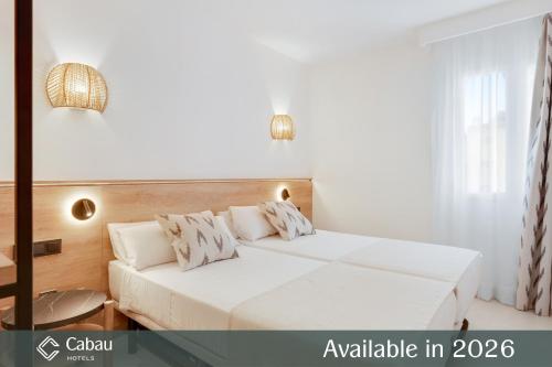 a bedroom with a bed with white sheets and pillows at Aparthotel Aquasol in Palmanova