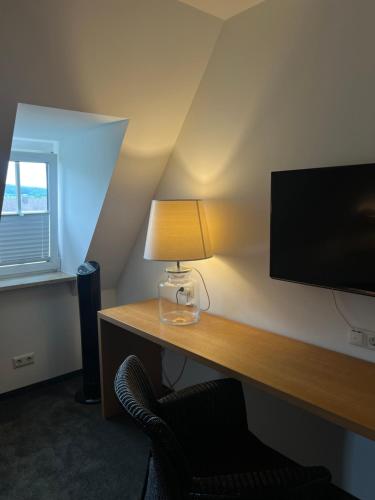 TV o dispositivi per l'intrattenimento presso Stadt Villa Boutiquehotel