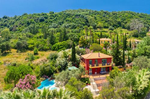 an aerial view of a house with a pool and trees at Villa Poseidonia in Katelios
