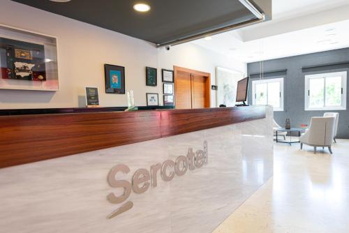 a bar at a scottsdale pharmacy with a counter at Sercotel Riscal in Puerto Lumbreras