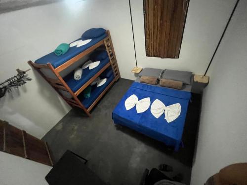 an overhead view of a bedroom with a blue bed at Casa Mandala Coliving in Lençóis