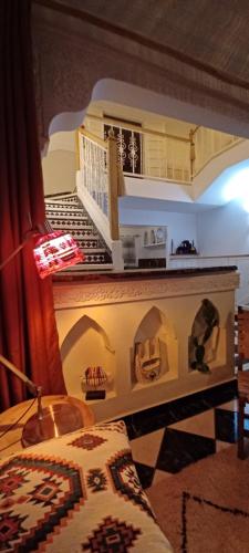 a bedroom with a model of a house at Riad Kechin Beldi in Marrakech