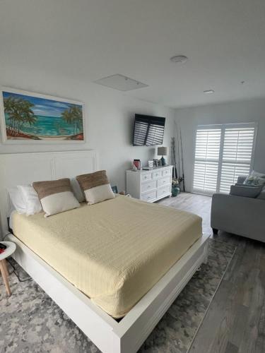 a bedroom with a large bed and a couch at Paradise awaits you!!!! in Marathon