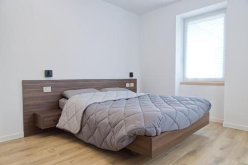 Postel nebo postele na pokoji v ubytování TRIPLETS Apartments