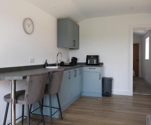 a kitchen with a sink and a counter top at The Calf House in Sibbertoft