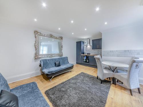 a living room with a couch and a table at Blossom Apartment - Uk45970 in Yarm