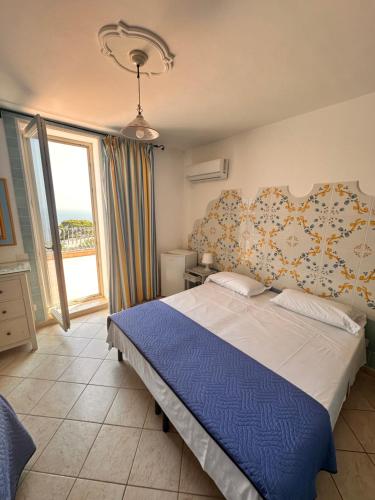 Postel nebo postele na pokoji v ubytování Hotel 4 Stagioni