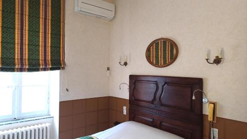 Un ou plusieurs lits dans un hébergement de l'établissement Hotel Montsegur