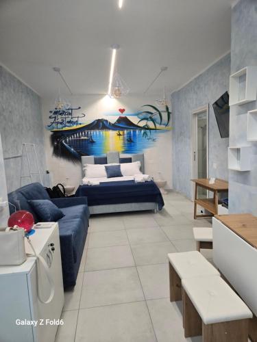 a living room with a bed and a couch at Margot Sorrento house e spa in Sorrento