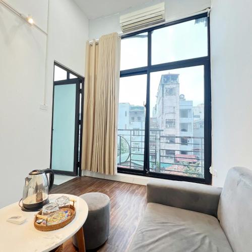 Coin salon dans l'établissement Hanowood Homestay