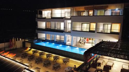 an aerial view of a building with a swimming pool at Stonehillkaş in Kas