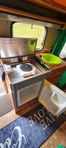 a small kitchen in the back of a vehicle at Tiny Anna's Cozy Home near Redbull Ring in Liesingthal